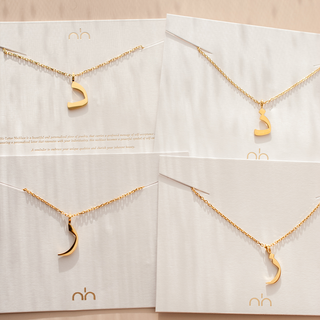 Nimah Arabic Letter Necklace in Gold Showing Four Different Arabic Letter Variations 